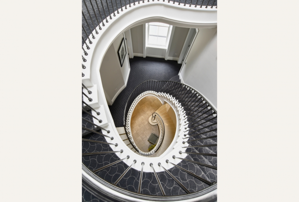 Modern yet classical villa with curved bay and elliptical staircase
