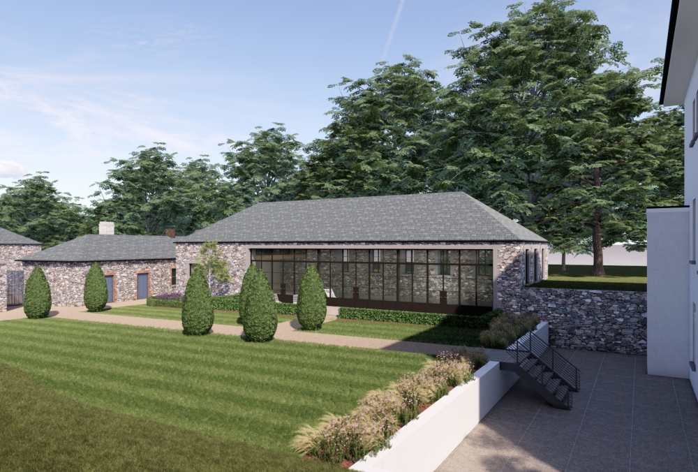 Pool house integrated between existing stone outbuildings and main house in Guernsey.