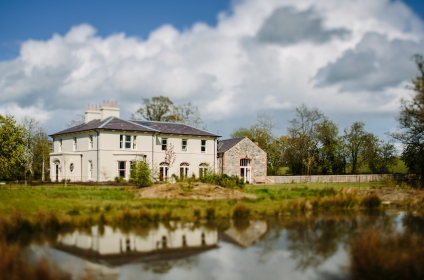 New Home Set in Extensive Landscaping & Wetlands